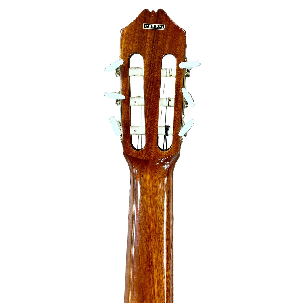 Vintage KASUGA KC-330 Classical Guitar Wooden guitar neck with truss rod cover on a tiled floor