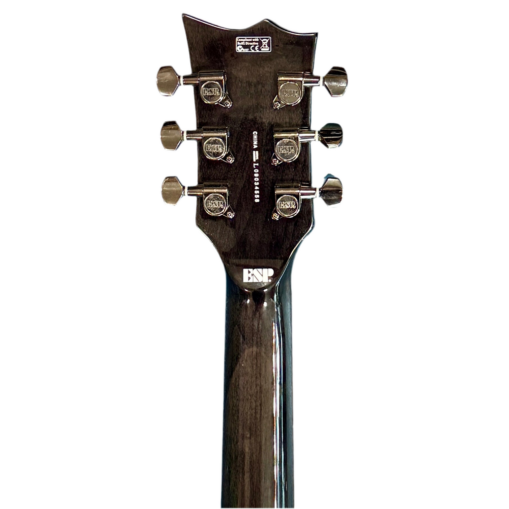 ESP LTD EC-100QM Electric Guitar Close-up of a guitar headstock with tuning pegs on a white background