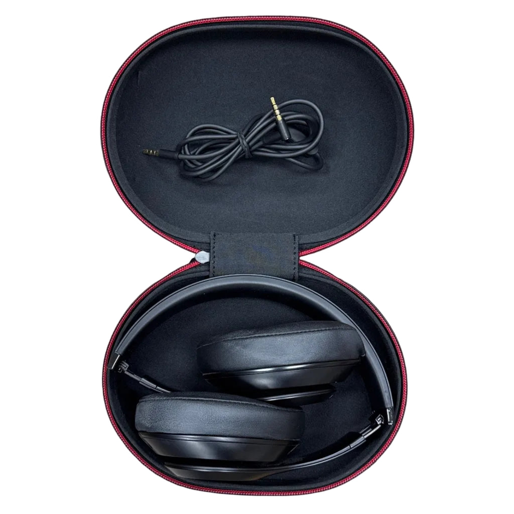 Apple Beats Studio3 Wireless Noise Cancelling Over-Ear Headphones w/ Case - Matte Black headphones in an open case with a coiled cable on a white background