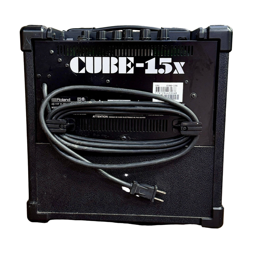 Roland CUBE-15X Guitar Combo Amplifier Roland Cube-15x guitar amplifier with power cord on a wooden surface