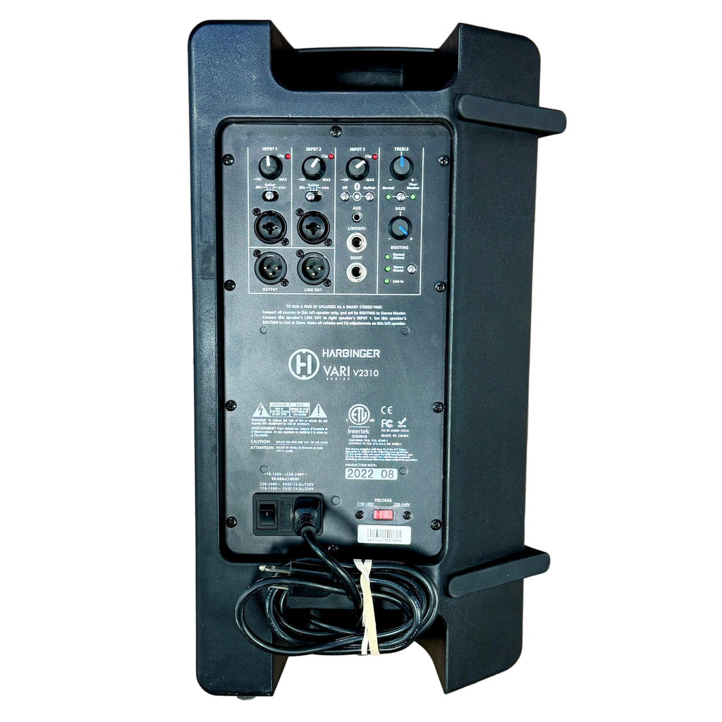 Harbinger VARI Series V2310 10" 2-Way Powered Speaker w/ Bluetooth Audio Input Black audio equipment on a wooden floor