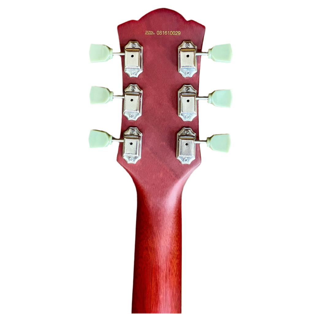 Bad Cat Instruments Les Paul Style Electric Guitar Close-up of a red guitar headstock with tuning pegs on a white background