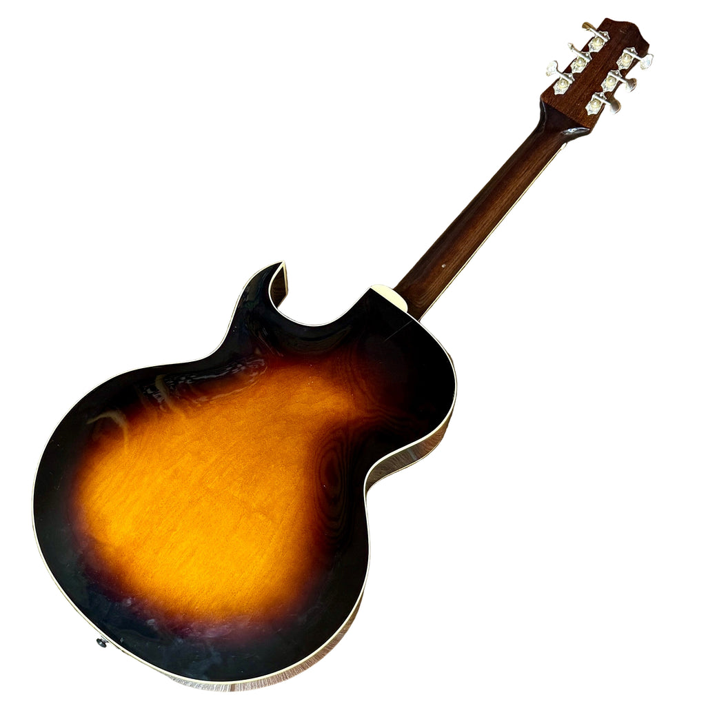 The Loar LH-280-CSN Hollow Body Electric Guitar Electric guitar with sunburst finish on a wooden floor