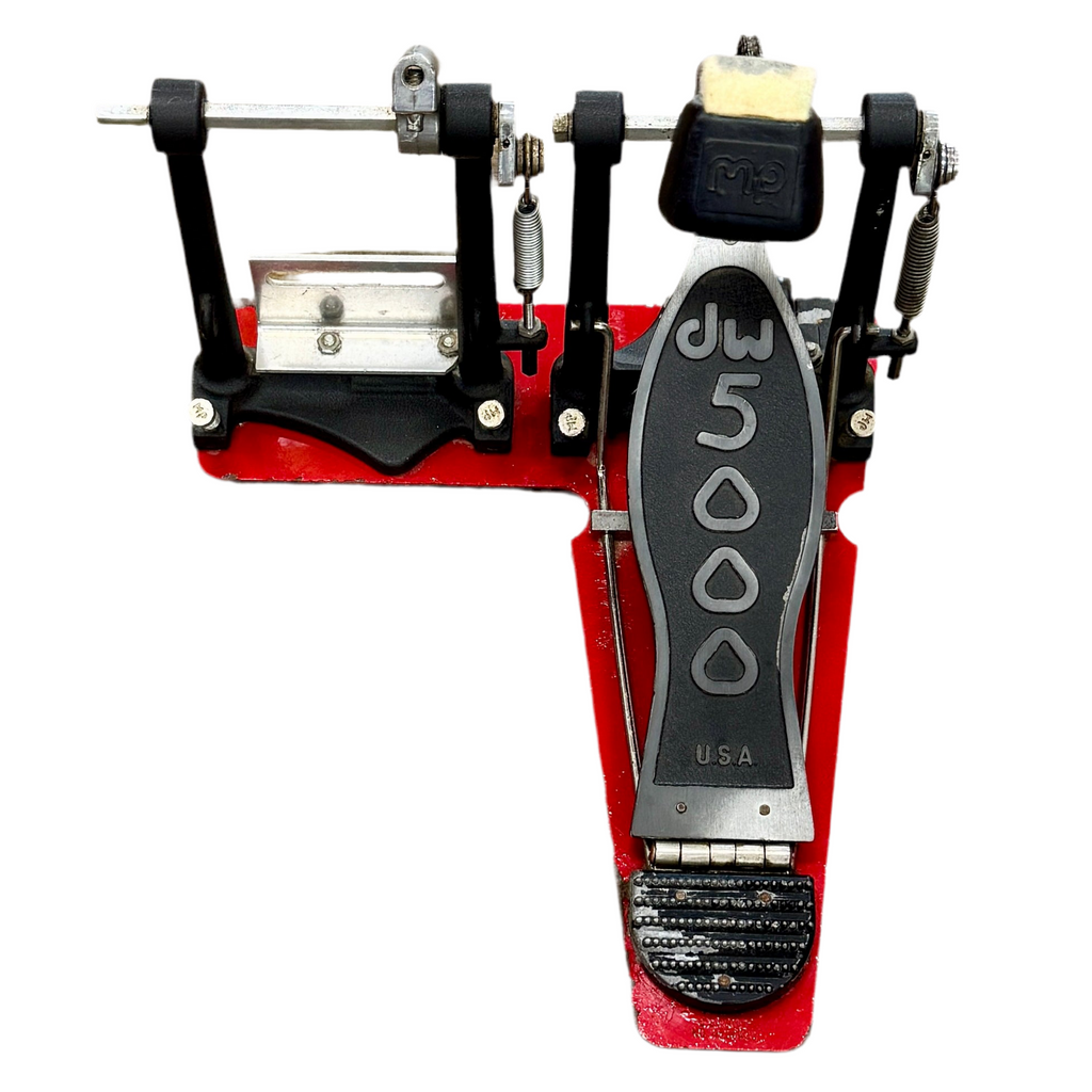 Red and black foot pedal with 'DW' branding on a white background