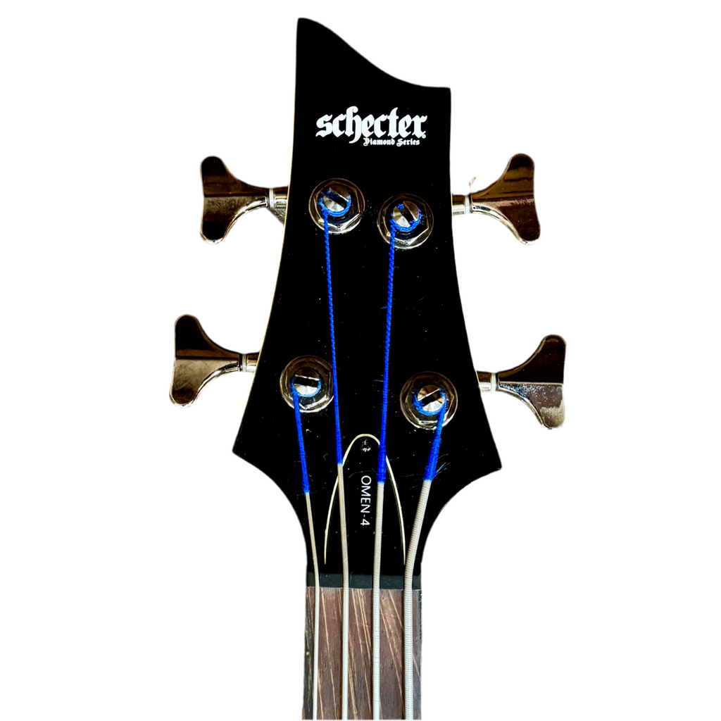 Schecter Diamond Series OMEN-4 Left-Handed Electric Bass Guitar headstock with 'Schecter' branding on a white background