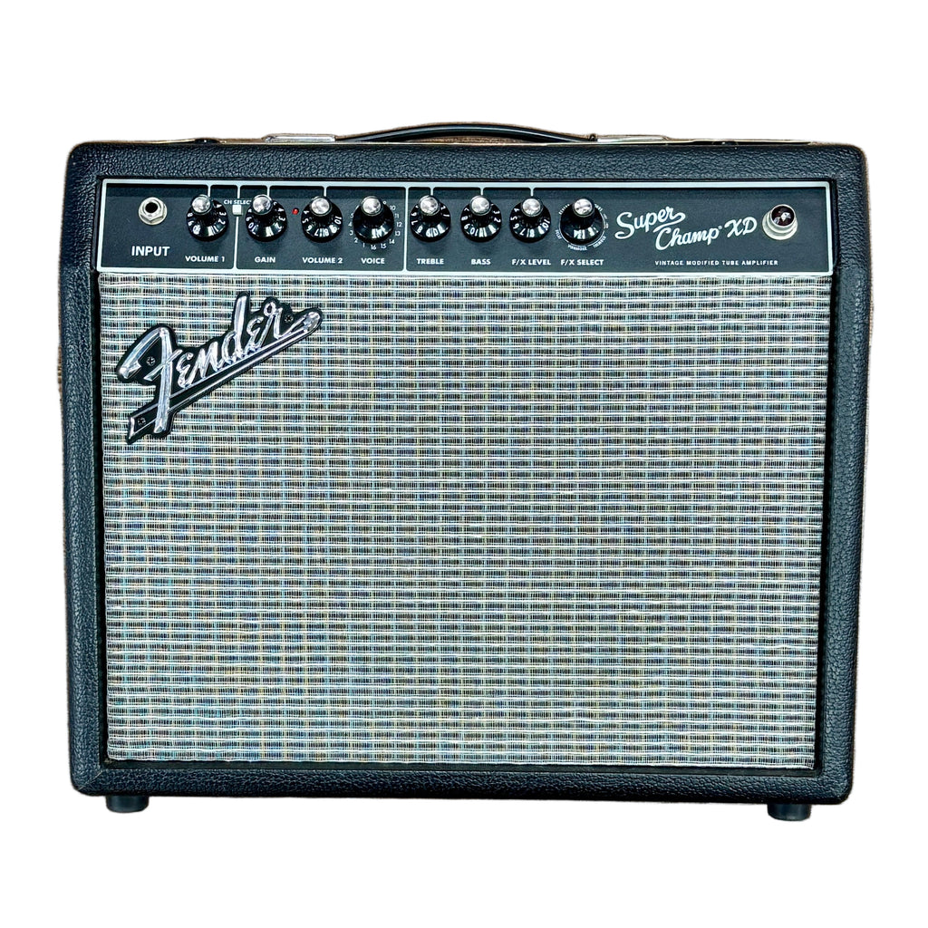 Fender Super Champ XD Guitar Combo Amplifier Fender amplifier on a wooden floor with a person's feet wearing sneakers.