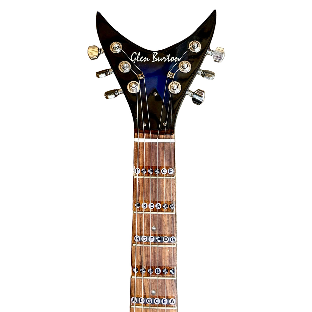 Glen Burton USA Shark Shape Electric Guitar neck with 'Glen Burton' branding on a wooden floor