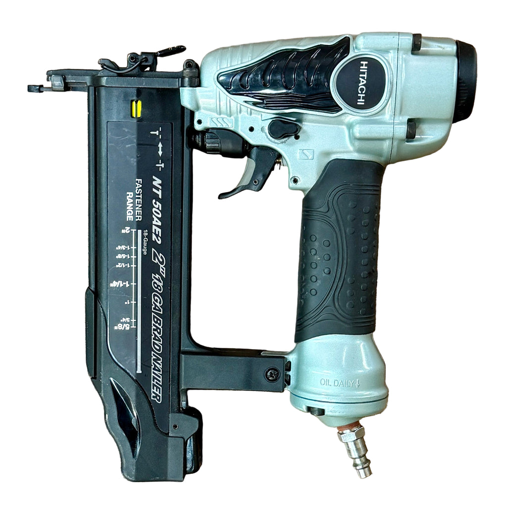HITACHI 18-Gauge 2" Pneumatic Brad Nailer w/ Hard Case (NT50AE2S) Nail gun and drill on a wooden surface