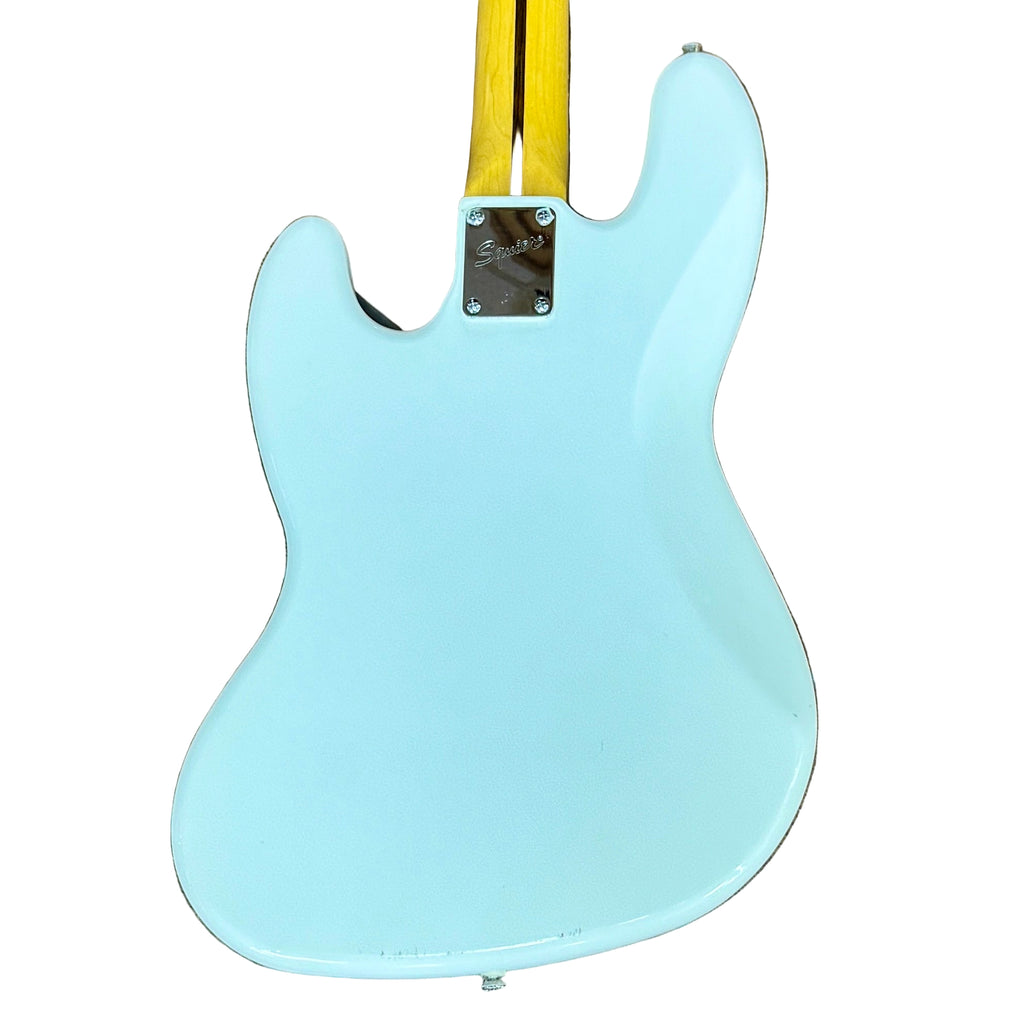 Fender Squier Jazz Bass Electric Bass Guitar w/ Hard Case Light blue electric guitar body on a wooden floor