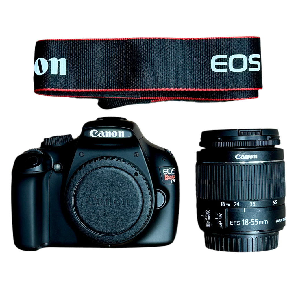Canon EOS REBEL T3 12.2 MP CMOS Digital SLR Camera w/ Canon Zoom Lens EF-S 18-55mm f/3.5-5.6 IS II Lens & Case Canon DSLR camera with lens and EOS branded strap on a white background