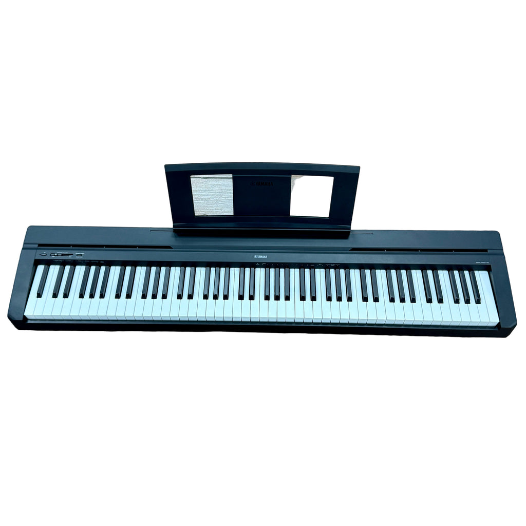 Yamaha P-45 88-Key Digital Piano w/ Speakers Digital piano on a wooden floor