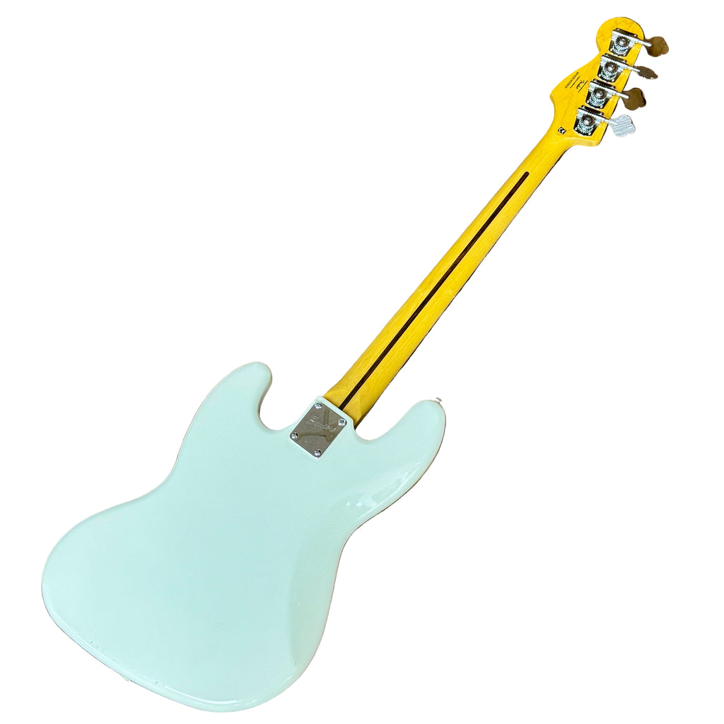 Fender Squier Jazz Bass Electric Bass Guitar w/ Hard Case White electric bass guitar with a yellow neck on a wooden floor