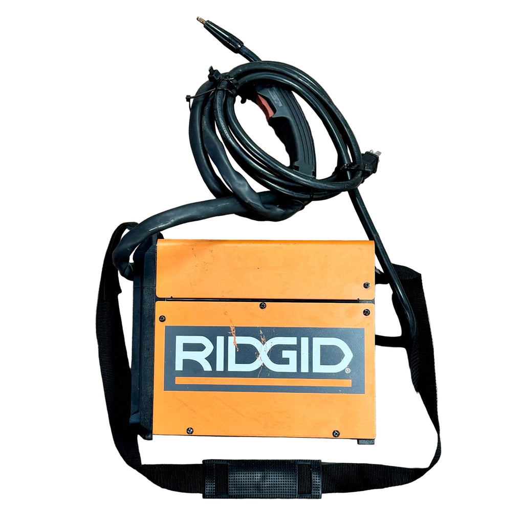 RIDGID FLUX-CORE PRO 90-Amp Corded Welder Feed Welder (RFC90) Orange RIDGID tool on a wooden floor