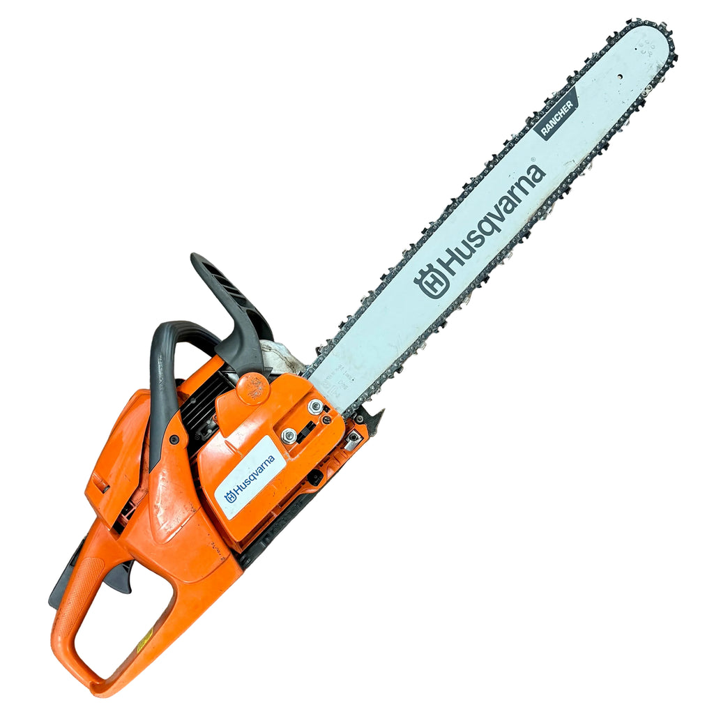 Husqvarna 460 Rancher 60cc 24" Guide Bar Gas-Powered Chainsaw Husqvarna chainsaw on a wooden floor