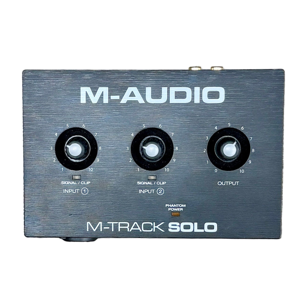 M-AUDIO M-TRACK SOLO USB Audio Interface M-Audio M-Track Solo audio interface on a wooden surface