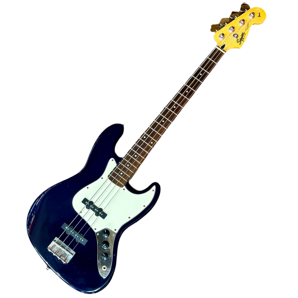 Blue fender squier jazz bass electric bass guitar with a yellow pickguard on a white background