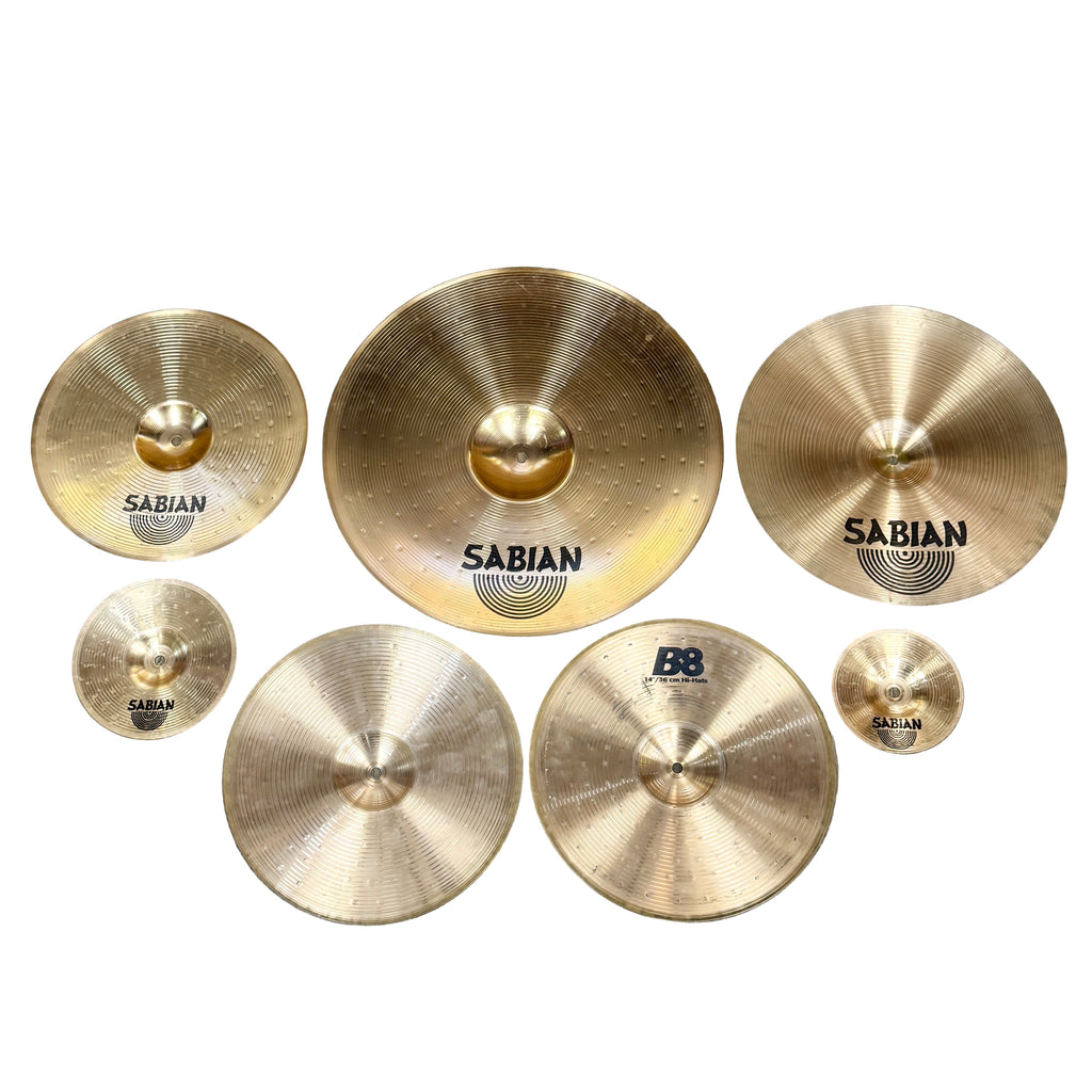 SABIAN B8 7-Piece Drum Cymbals Set (20" Ride, 16" Thin Crash, 14" Hi-Hats, 14" Thin Crash, 8" Splash, 6" Splash) Set of Sabian cymbals on a wooden floor
