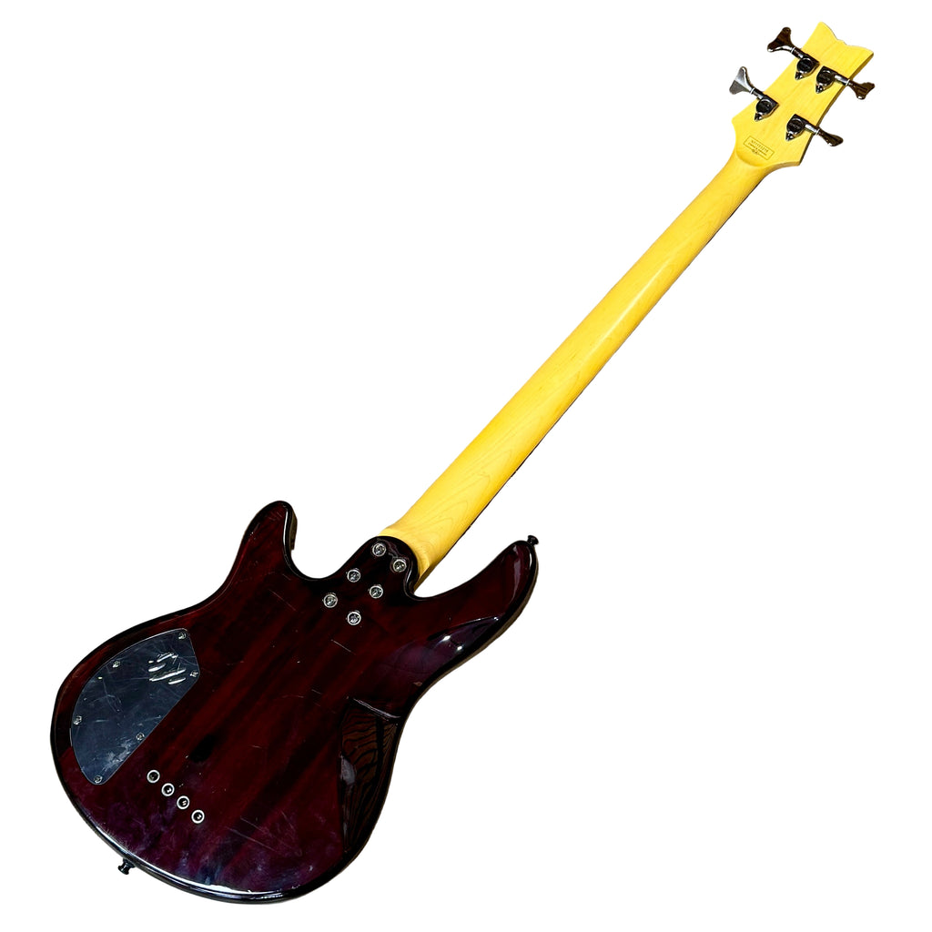 Schecter Diamond Series RAIDEN SPECIAL-4 Electric Bass Guitar (Missing 1st String) Bass guitar with a yellow neck on a wooden floor