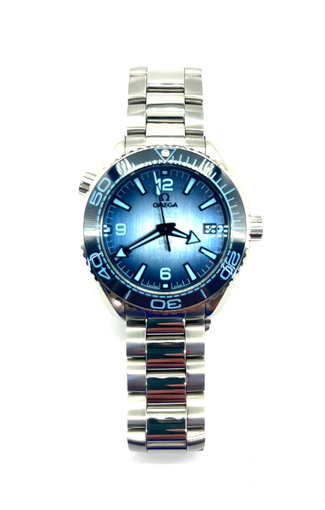 Silver watch with blue face on a white background