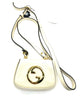 White handbag with gold accents on a white background