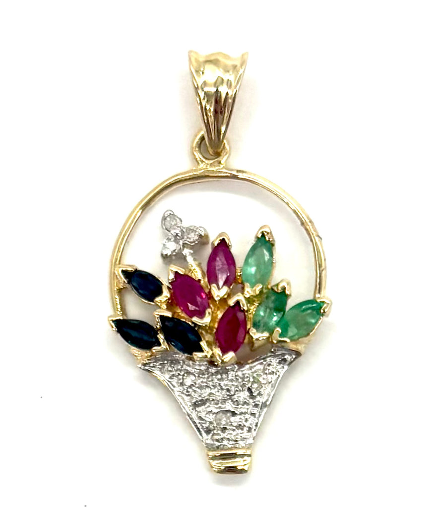 Gold pendant with gemstones on a white background