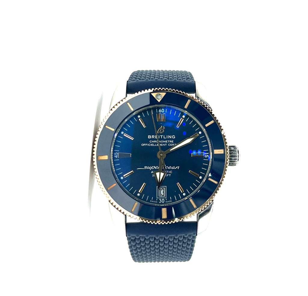 Blue watch with a detailed face on a white background