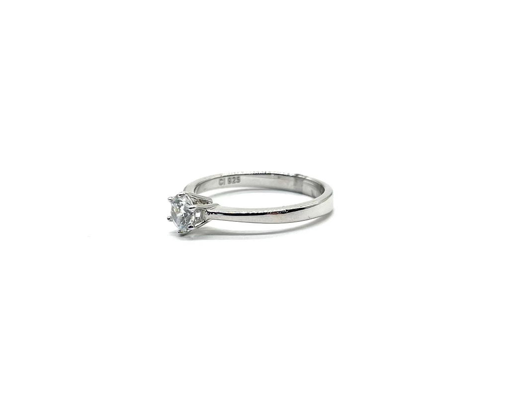 Silver ring with a diamond on a white background