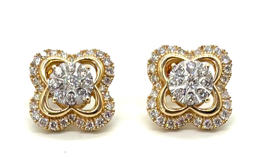 Pair of gold and diamond earrings on a white background