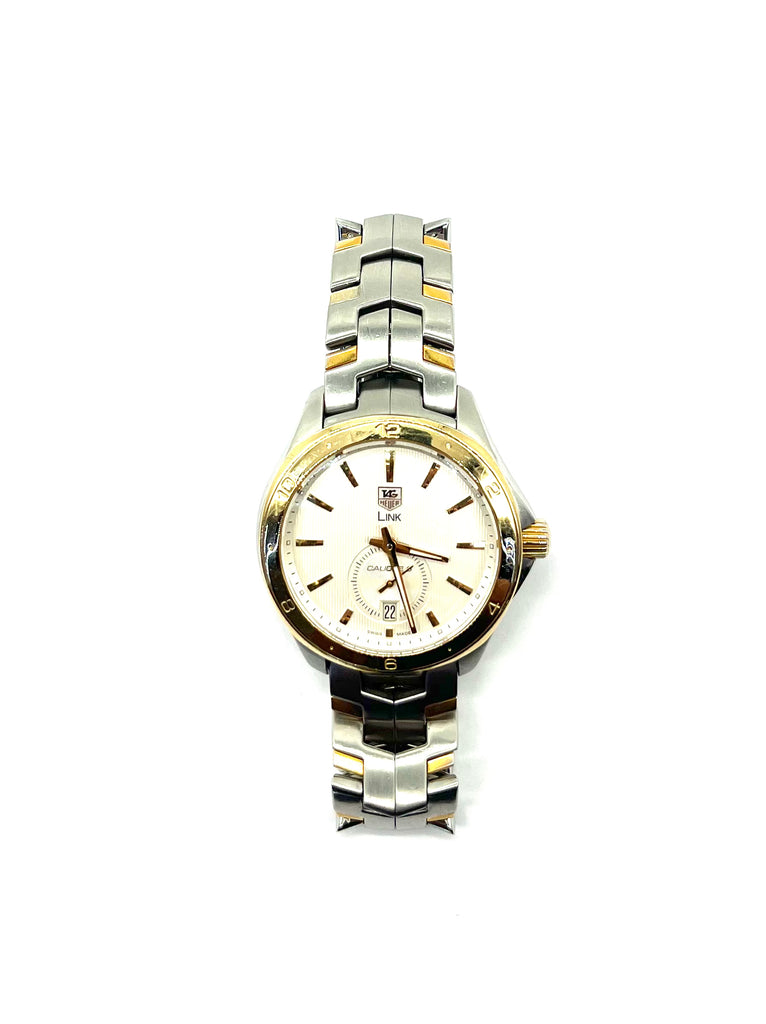 Two-tone watch with silver and gold band on a white background