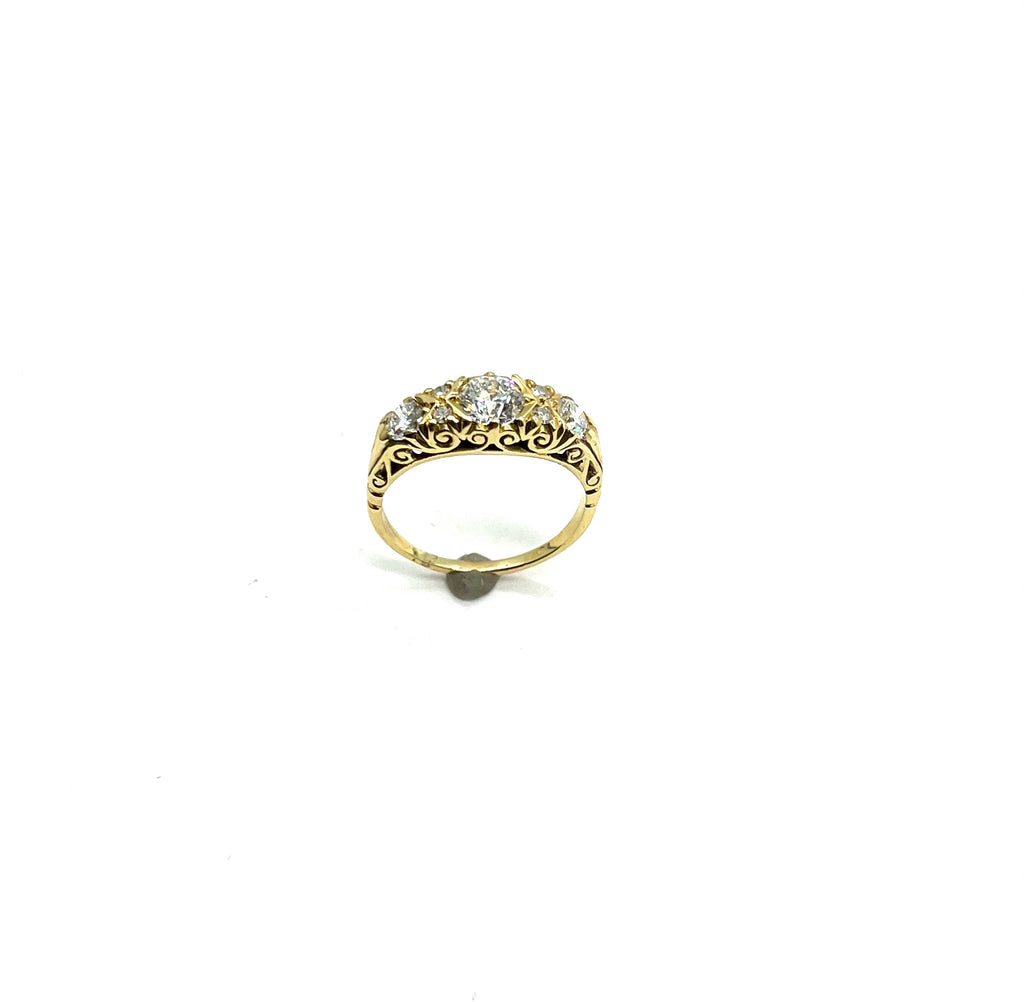 Gold ring with diamonds on a white background