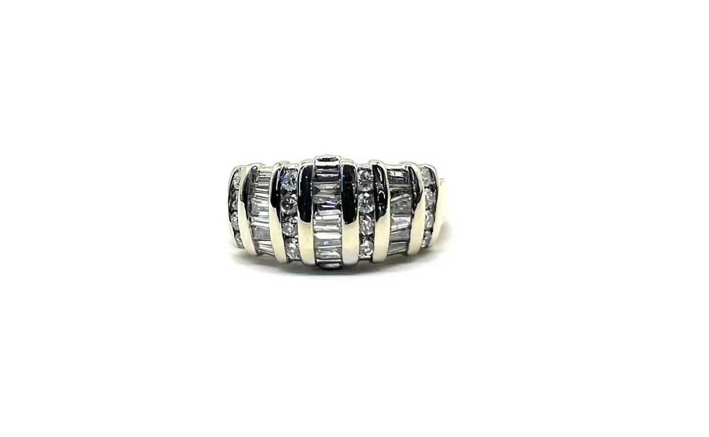 Silver ring with black and white stones on a white background