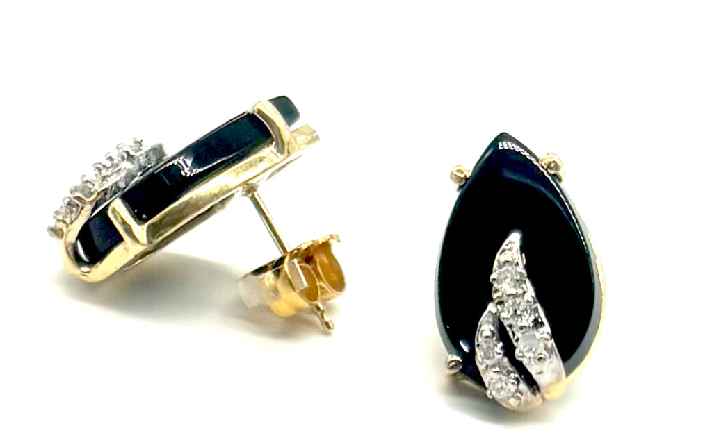 Pair of black teardrop earrings with gold accents on a white background