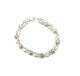.925 Sterling Silver 12.9G Rose and Leaf Link Bracelet Silver bracelet with floral designs on a white background