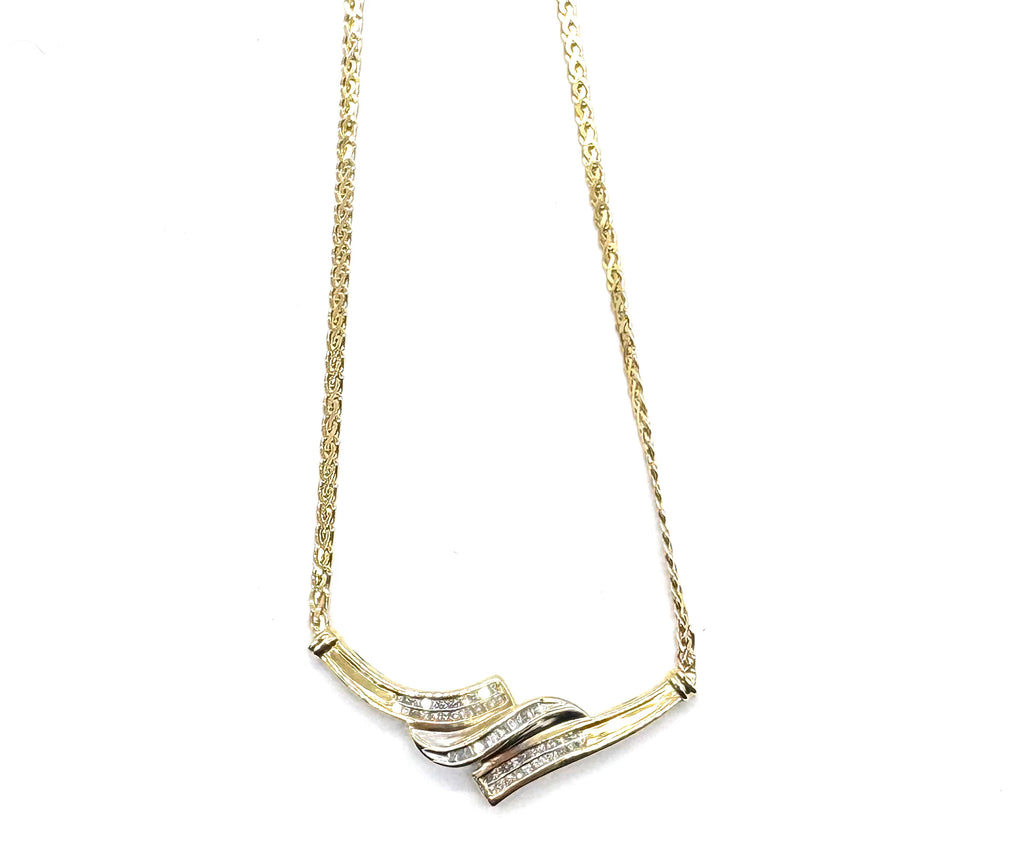 Gold necklace with a unique design on a white background