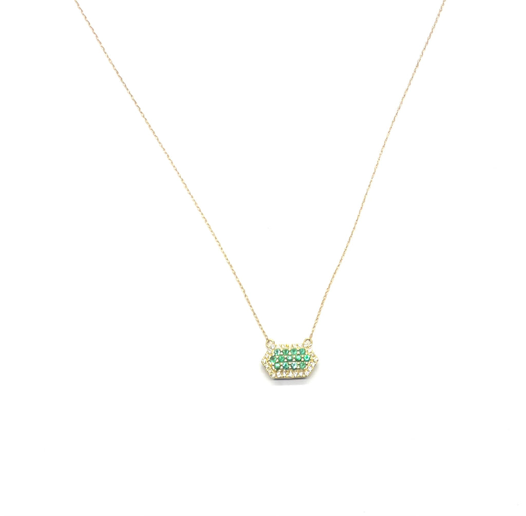 Necklace with a green gemstone pendant on a white background