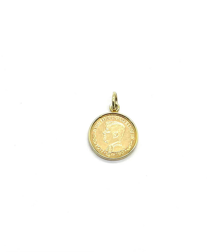 Gold coin pendant on a white background