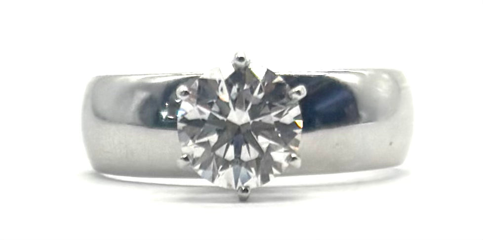 Silver ring with a diamond on a white background