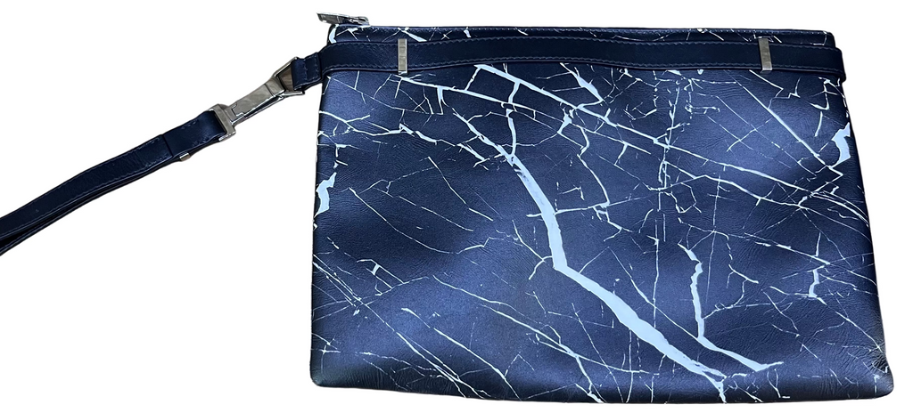 Blue marble-patterned pouch with a strap on a wooden surface