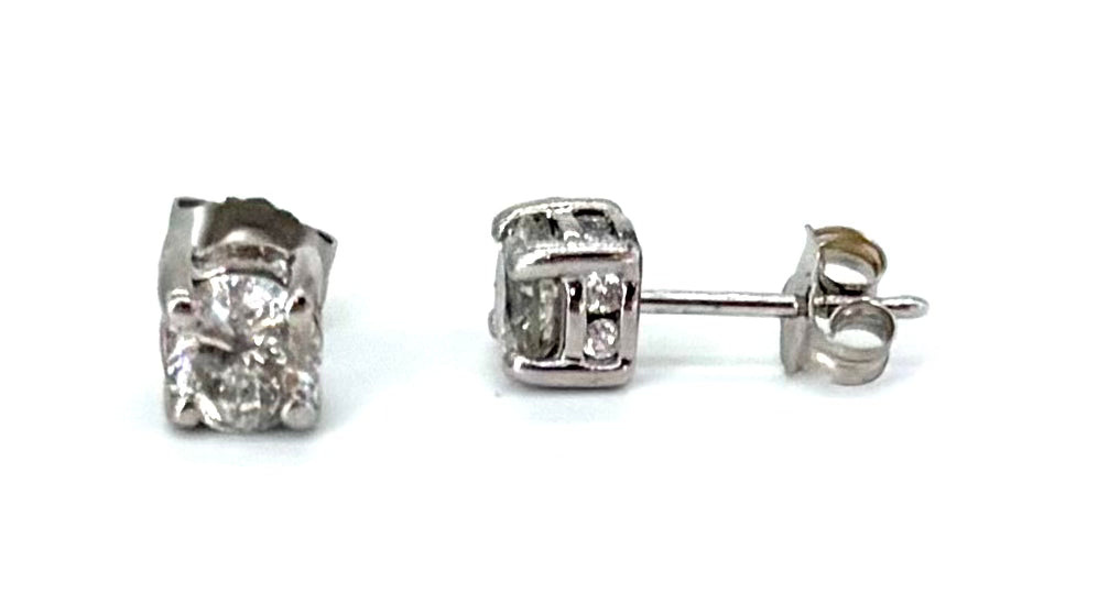 Pair of diamond stud earrings on a white background