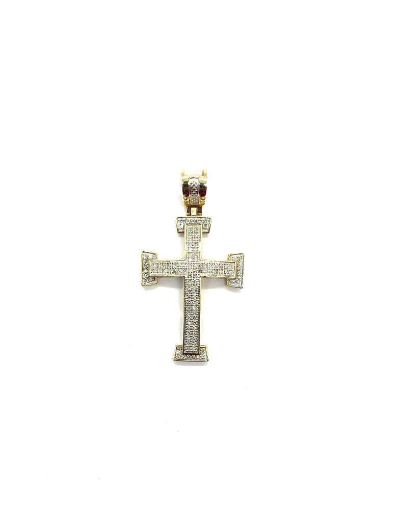 Gold cross pendant with diamonds on a white background