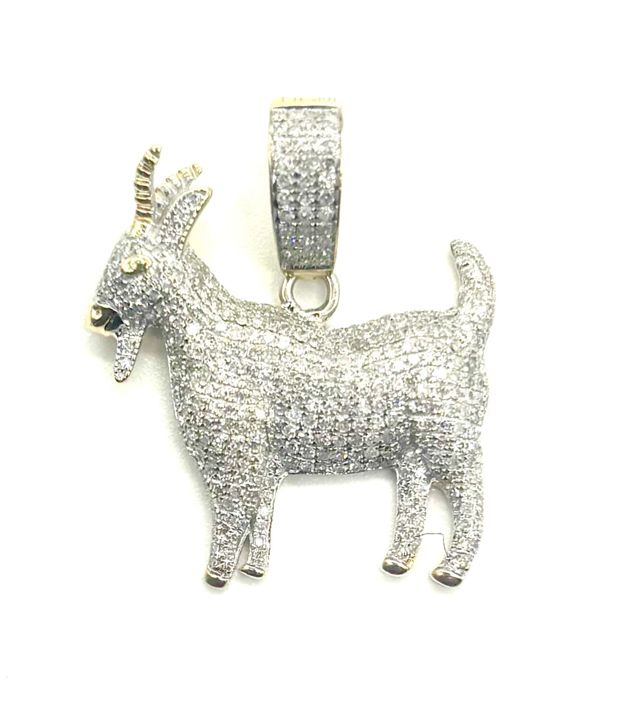 Silver goat pendant with clear stones on a white background
