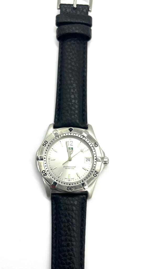Wristwatch with black strap and silver case on a white background