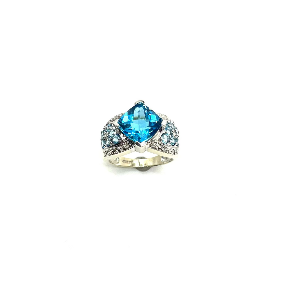 Ring with a blue gemstone on a white background