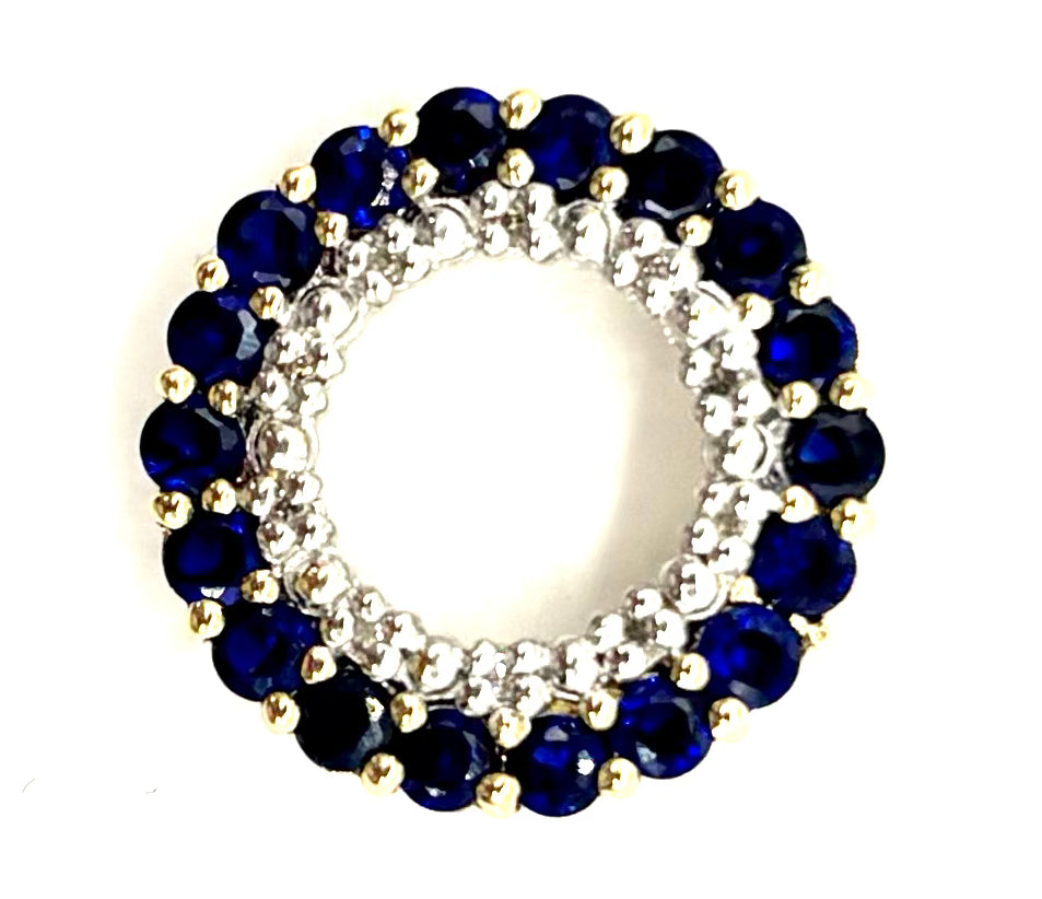 Jewelry item with blue gemstones and gold accents on a white background