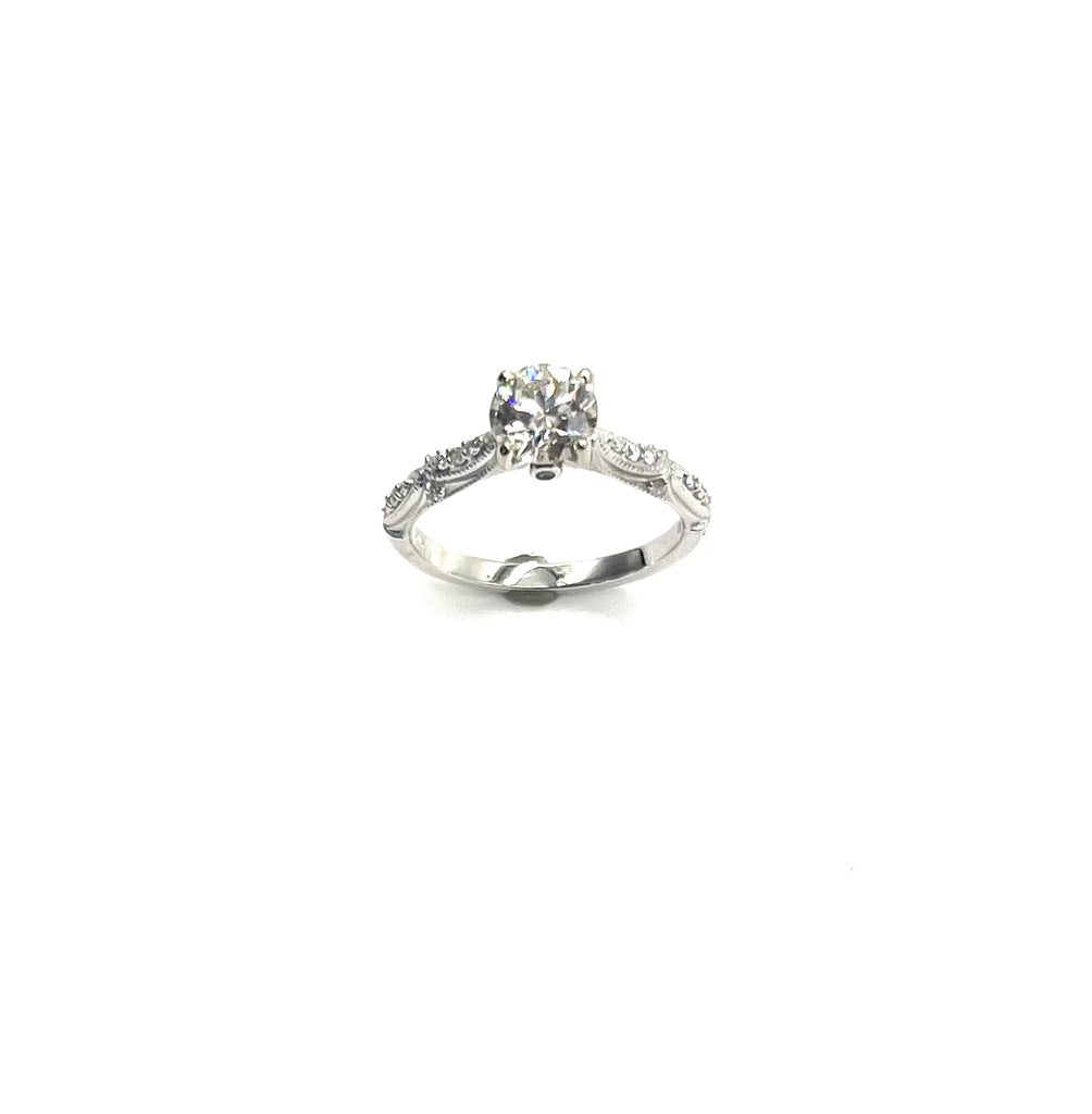 Silver ring with a diamond on a white background
