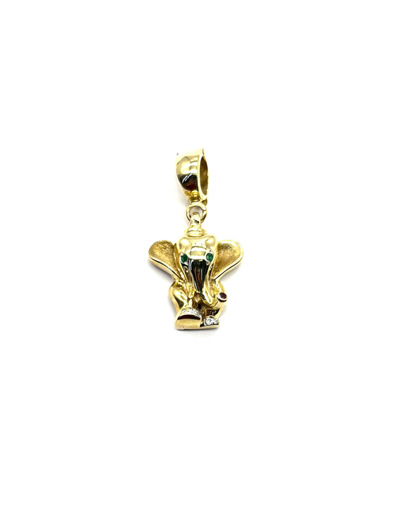 Gold elephant pendant with green gemstone on a white background
