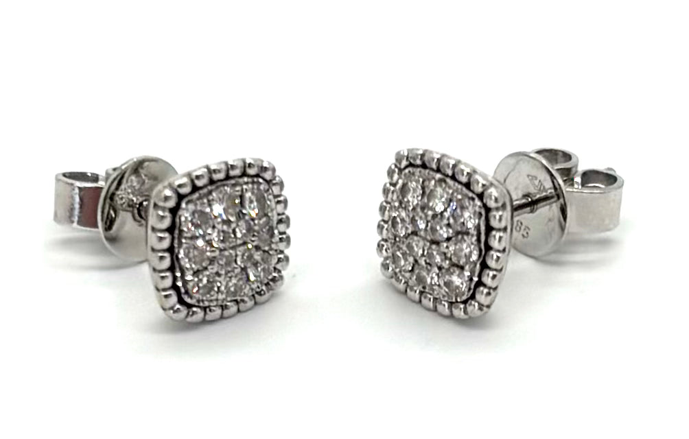 Pair of silver stud earrings with clear gemstones on a white background