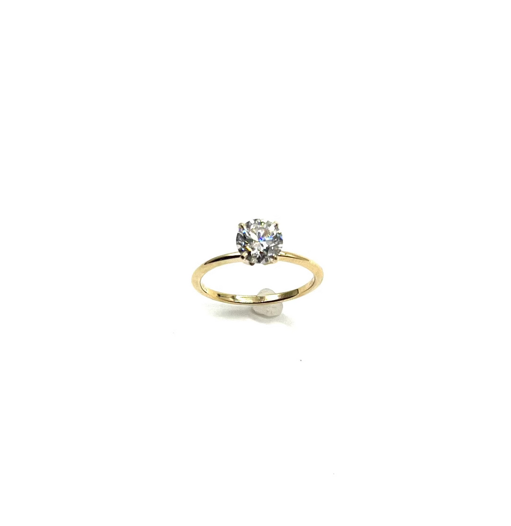 Gold ring with a diamond on a white background