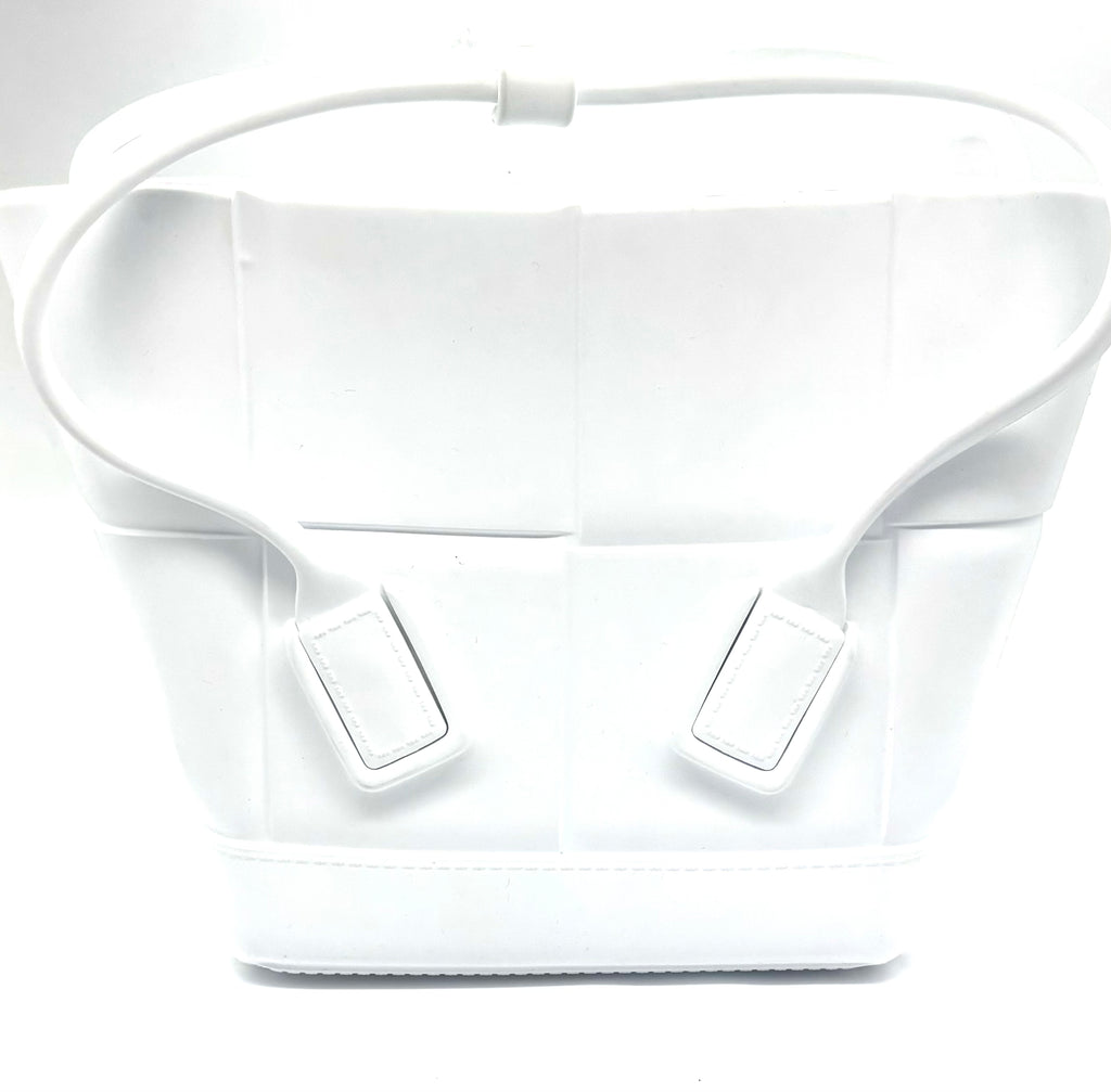 White bag with a strap on a light gray background