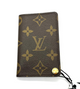 Louis Vuitton wallet with monogram pattern on a white background